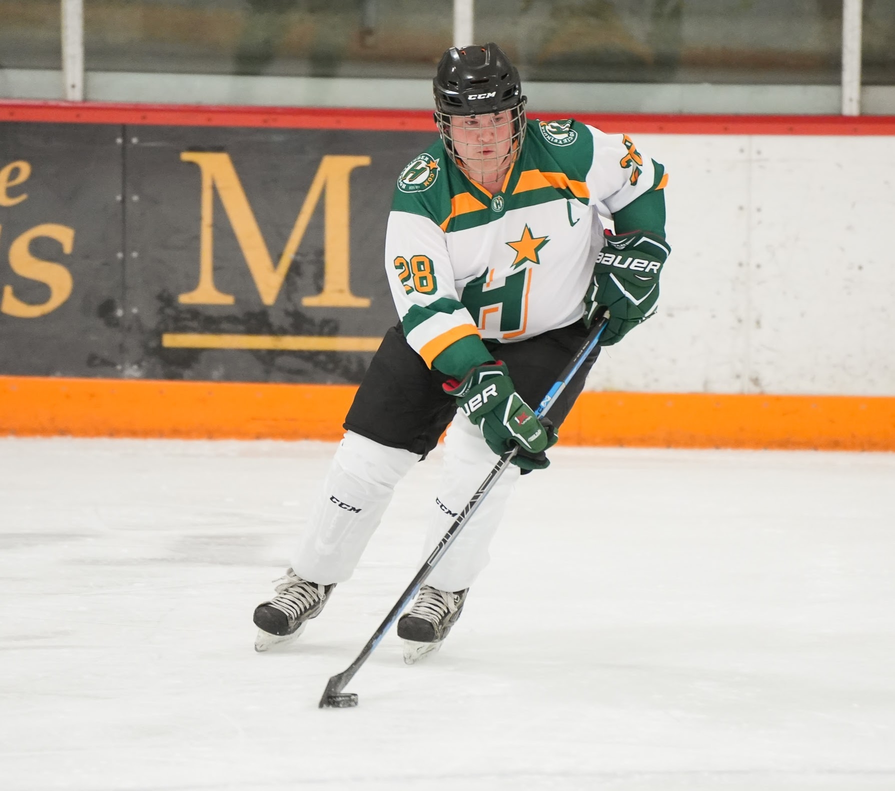 This is a picture of me skating in my full Hockey Finder gear with the puck on my stick